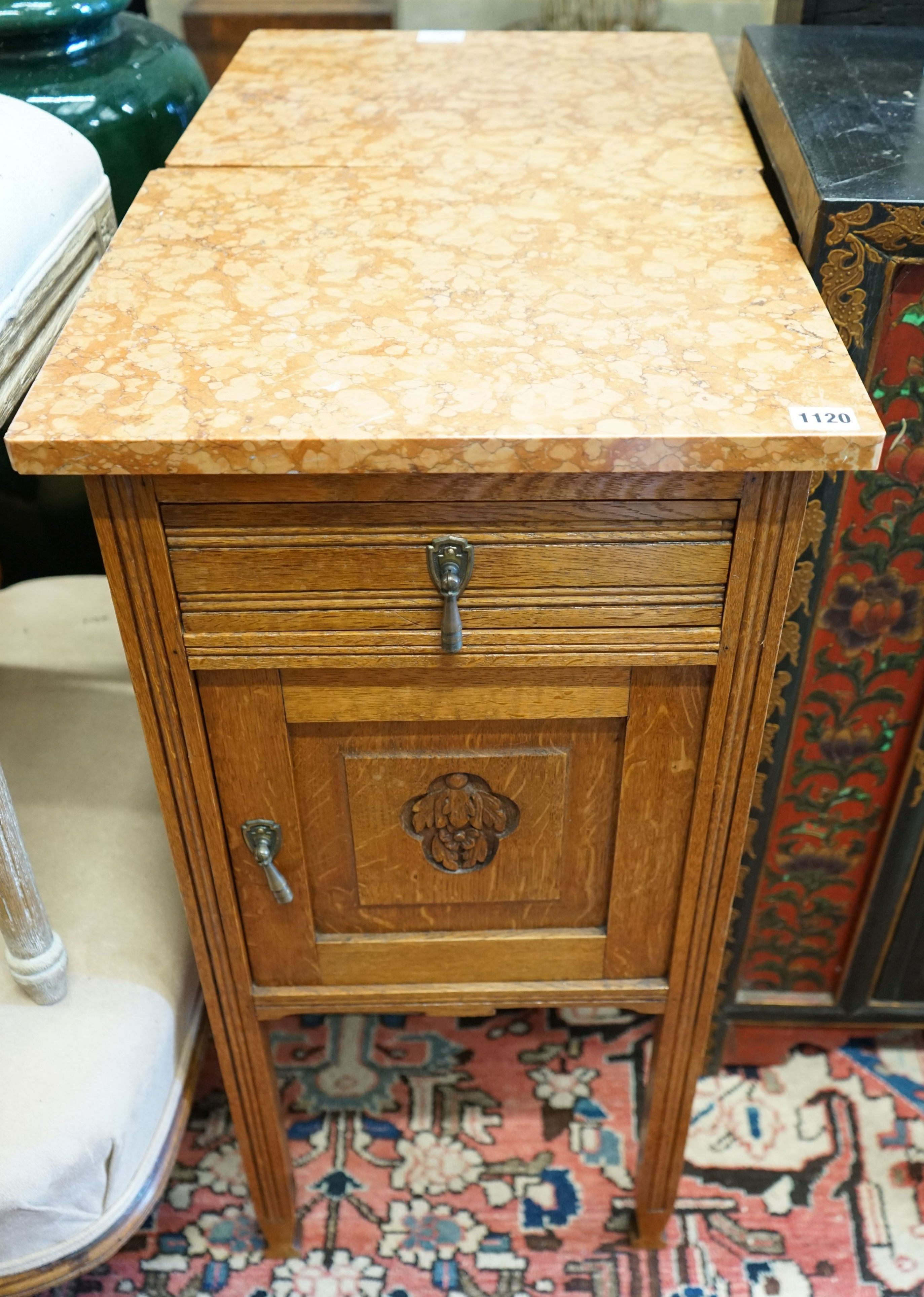 A pair of early 20th century marble topped carved oak bedside cabinets, width 42cm, depth 38cm, height 82cm
